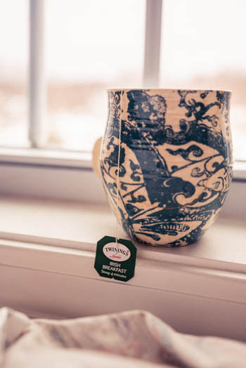 My favorite blue & white tea mug (that Bryan so graciously repaired for me) sitting on the window sill with Twining's Irish Tea steeping.