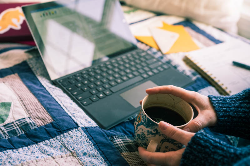 Using Surface Pro and Microsoft Word to hash out my character voices while dangerously drinking a cup of coffee on the bed.