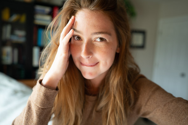 A blurry attempt to take my own portrait in our bedroom with Dana's bookshelf.